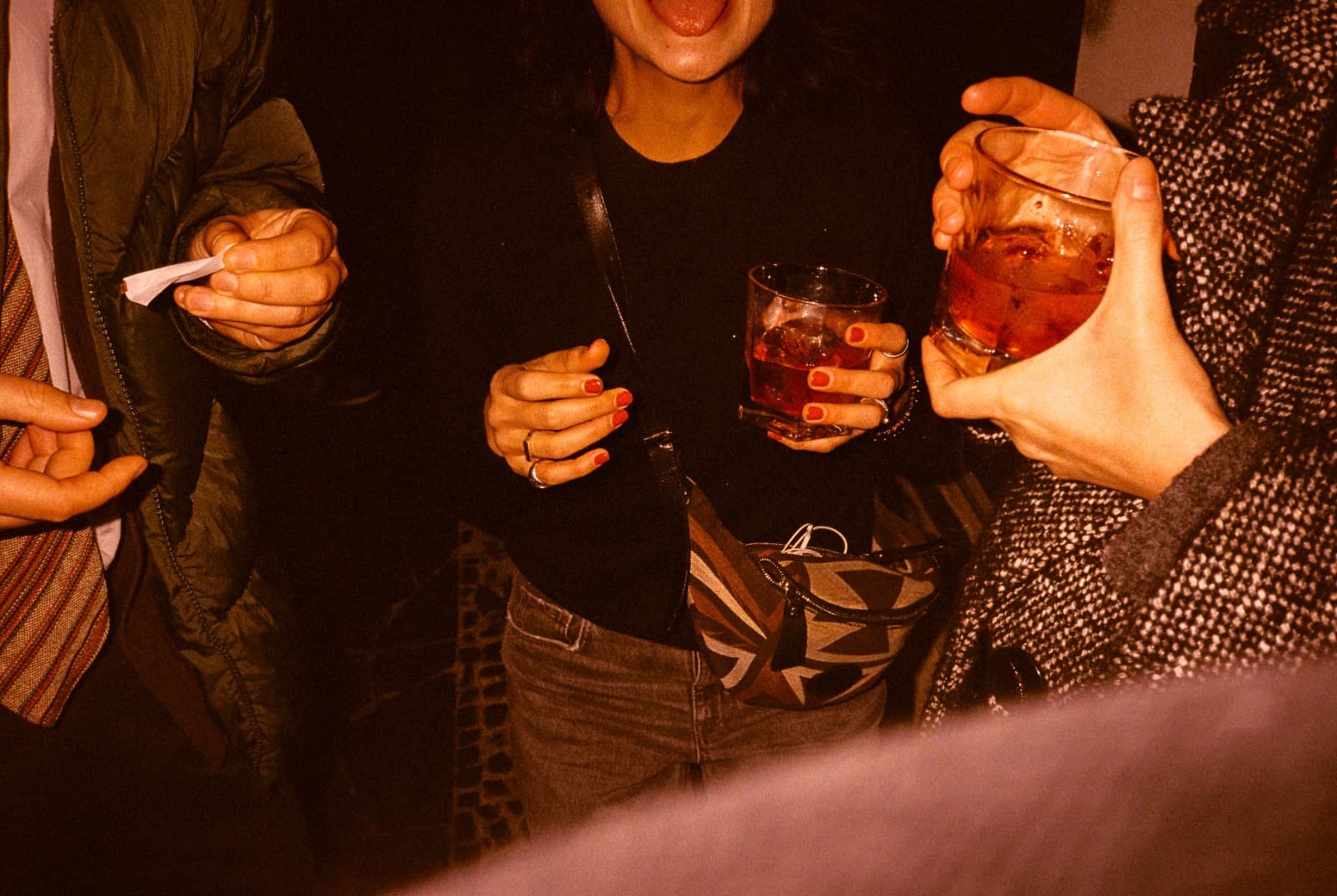 Honey Lou guests with drinks — analog film